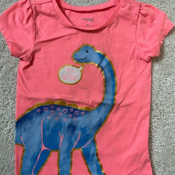 Simple Coral Pink Tee with Blue Dinosaur and Gold Accents - Picture 1 of 5